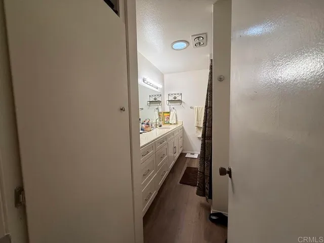 a bathroom with a sink and mirror
