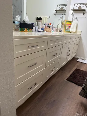 a kitchen with cabinets appliances and a counter space