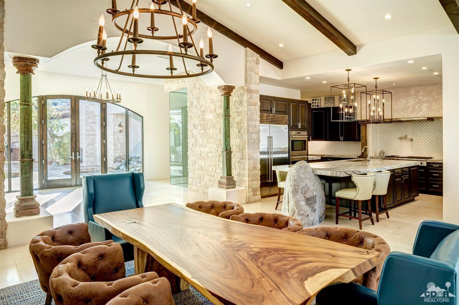 18 Rockcrest Drive Rancho Mirage, CA 92270 - Photo 12 of 35 a bedroom with furniture and a large window