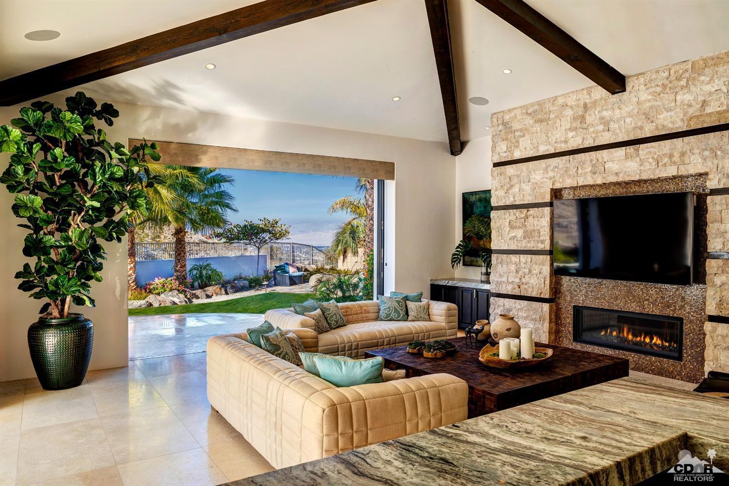 18 Rockcrest Drive Rancho Mirage, CA 92270 - Photo 15 of 35 a living room with furniture and a fireplace