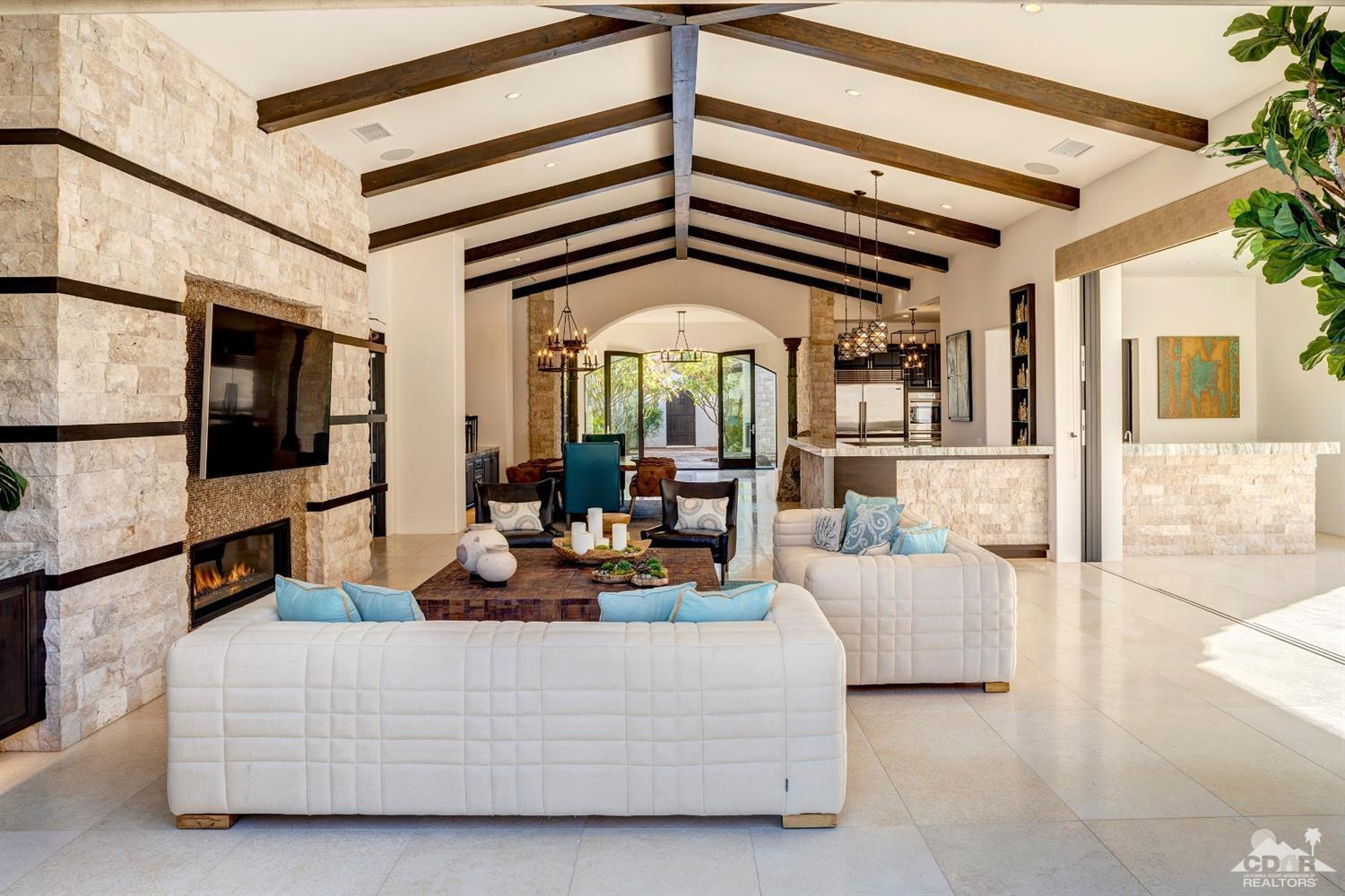 18 Rockcrest Drive Rancho Mirage, CA 92270 - Photo 16 of 35 a living room with furniture fireplace and a flat screen tv