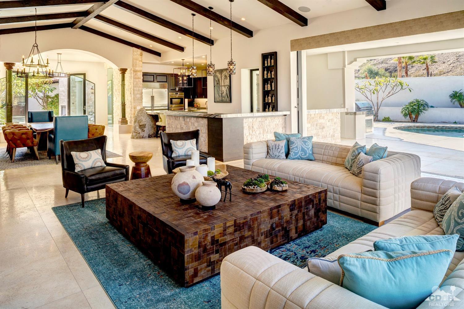 18 Rockcrest Drive Rancho Mirage, CA 92270 - Photo 17 of 35 a living room with furniture and a large window