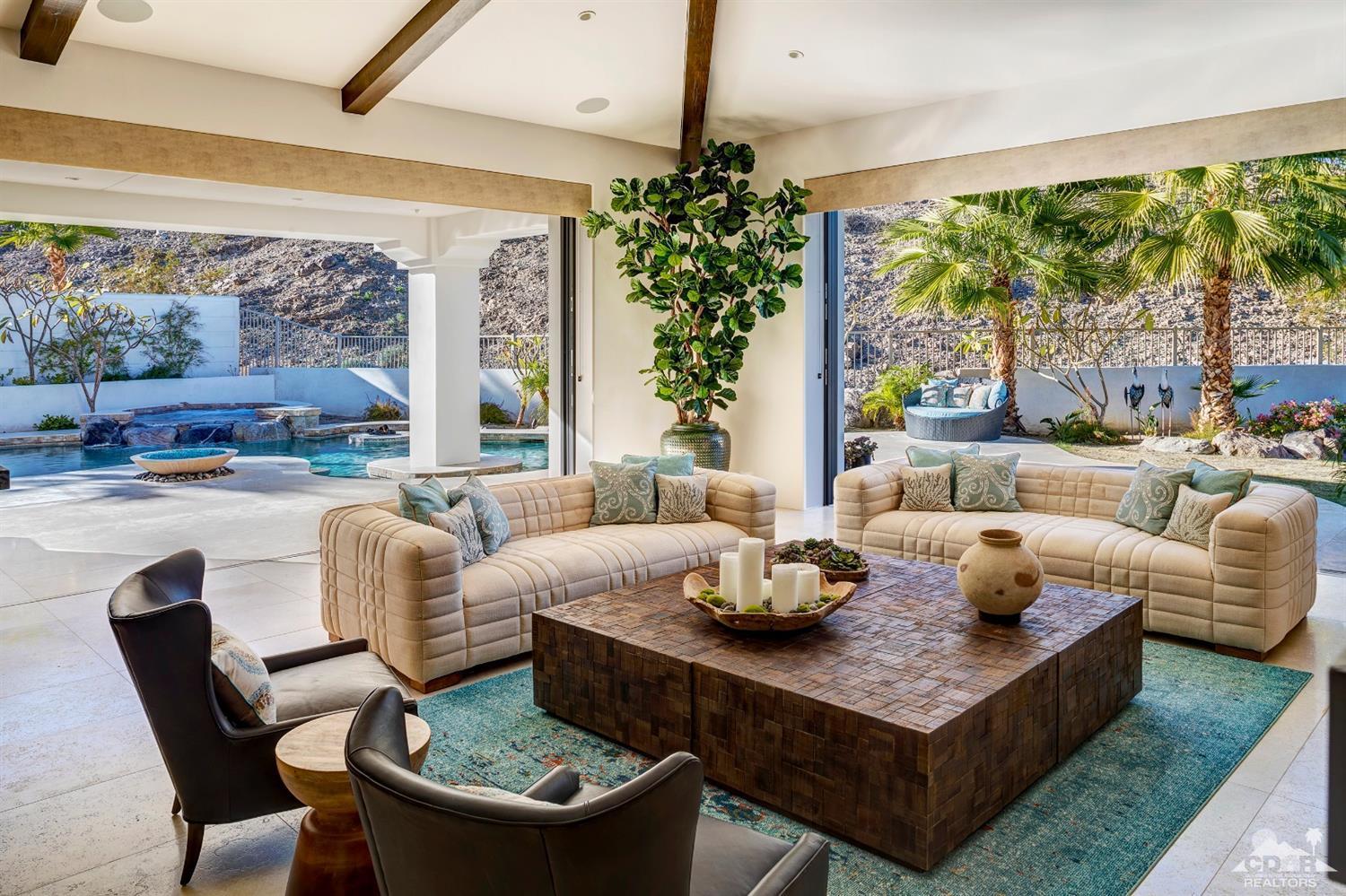 18 Rockcrest Drive Rancho Mirage, CA 92270 - Photo 18 of 35 a living room with furniture and a large window