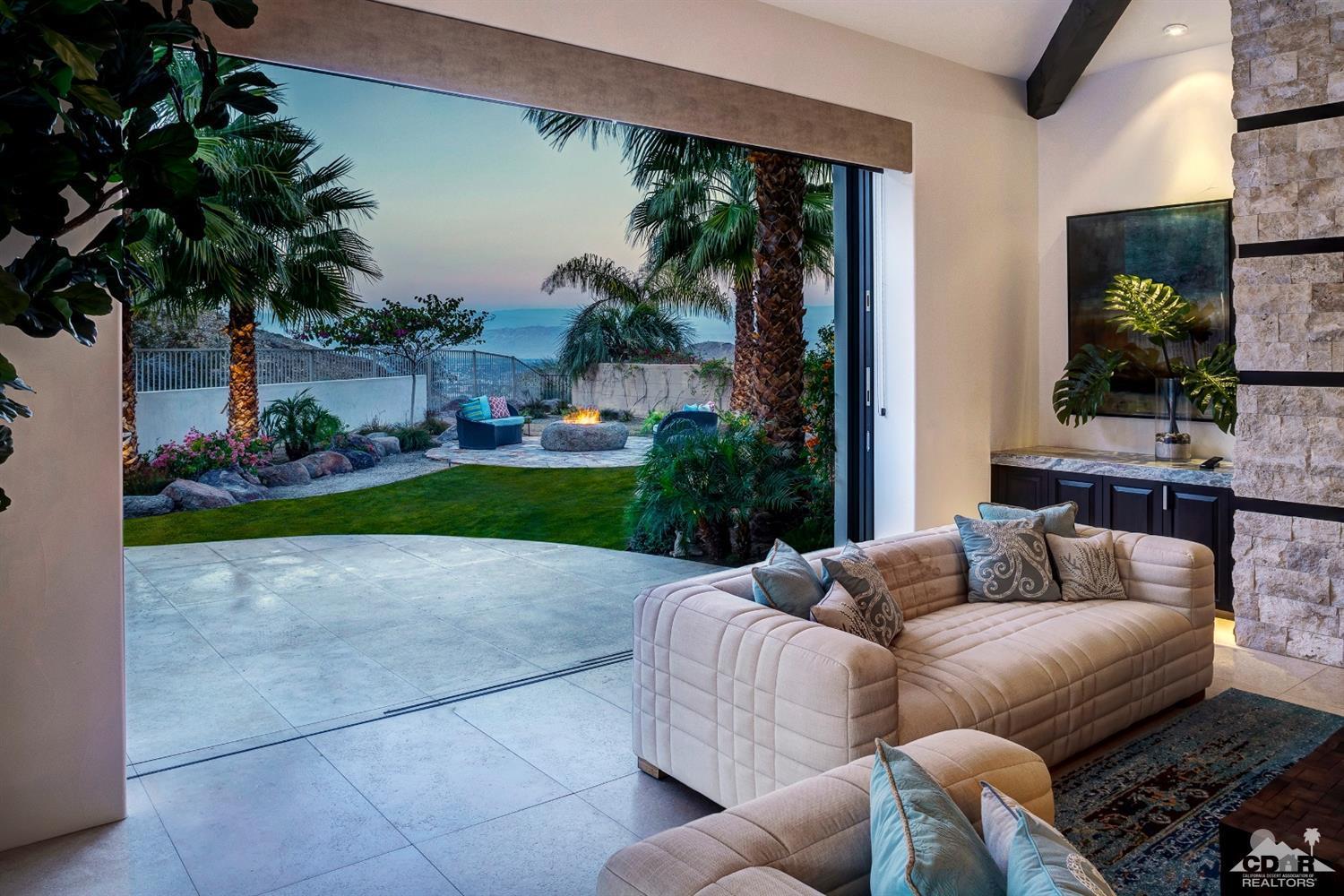 18 Rockcrest Drive Rancho Mirage, CA 92270 - Photo 19 of 35 a living room with furniture a garden and a yard