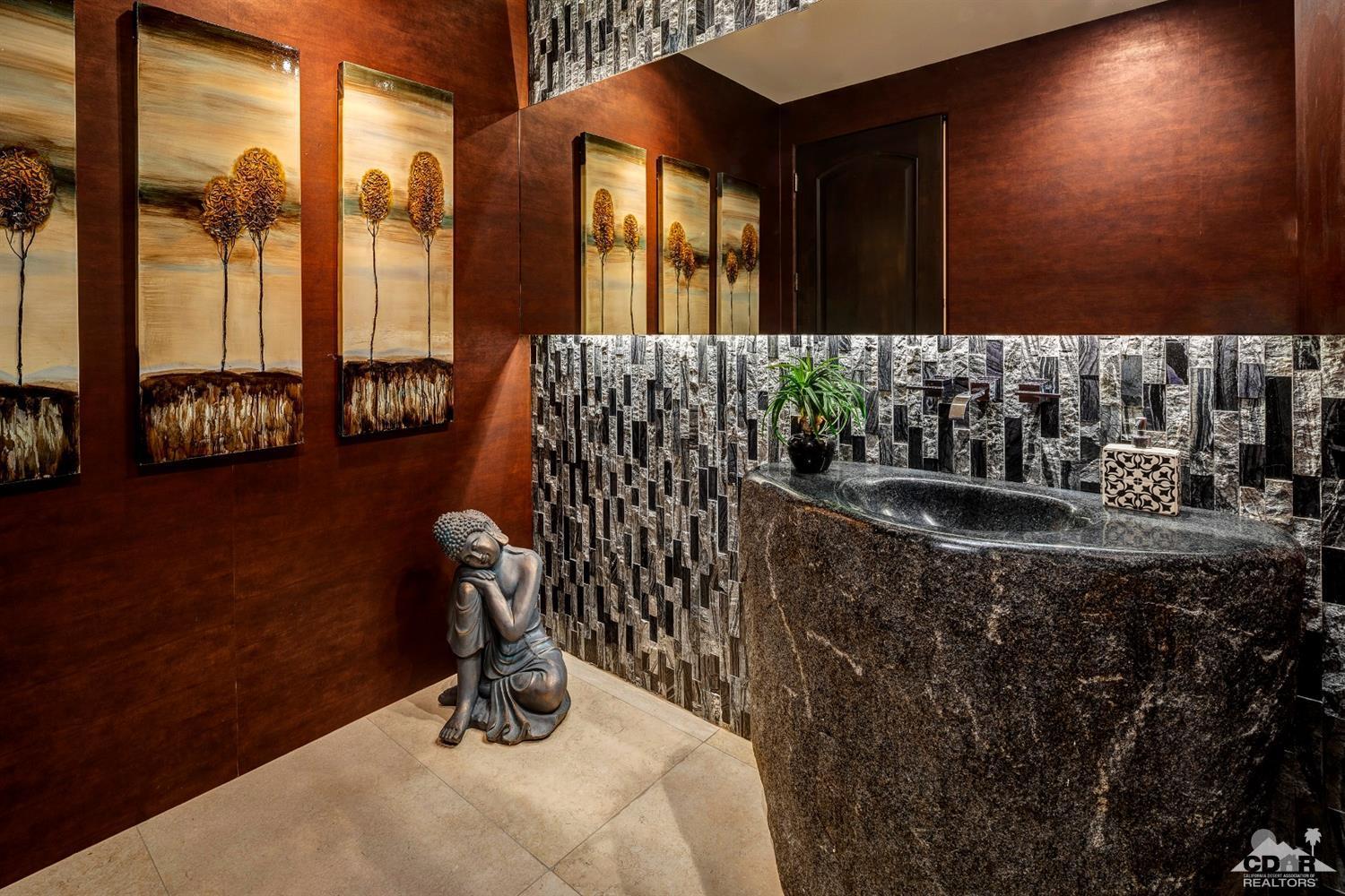 18 Rockcrest Drive Rancho Mirage, CA 92270 - Photo 20 of 35 a bathroom with a sink and a mirror