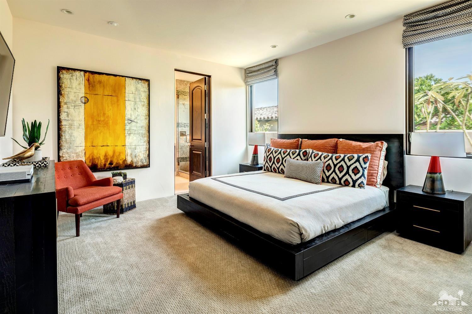 18 Rockcrest Drive Rancho Mirage, CA 92270 - Photo 28 of 35 a bedroom with a bed and large window