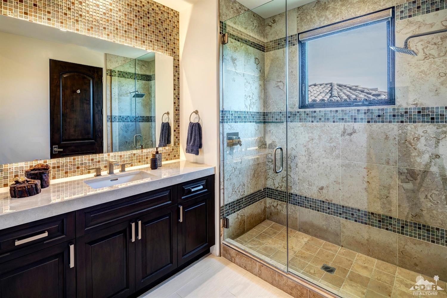 18 Rockcrest Drive Rancho Mirage, CA 92270 - Photo 29 of 35 a bathroom with a sink and a mirror