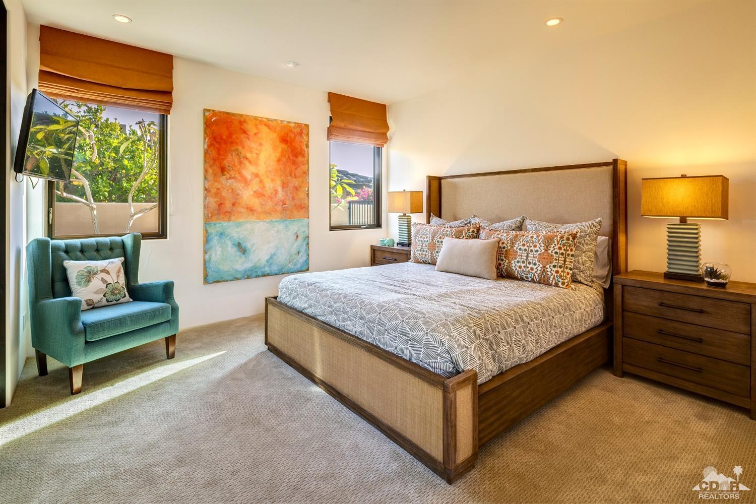 18 Rockcrest Drive Rancho Mirage, CA 92270 - Photo 30 of 35 a bedroom with a bed and a couch