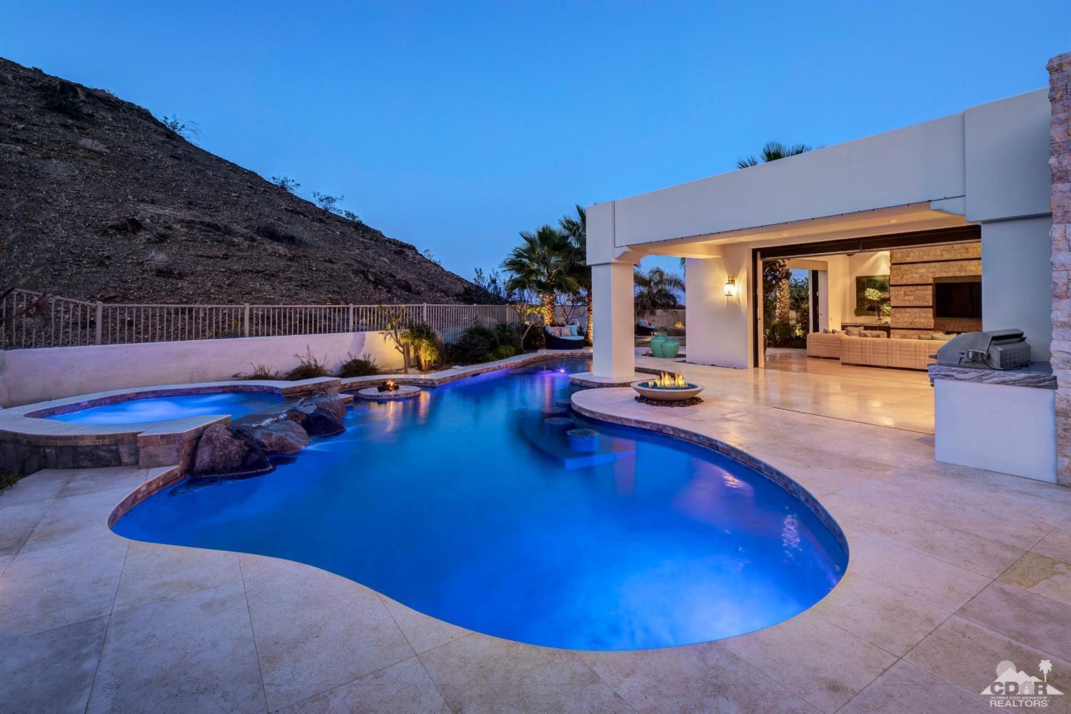 18 Rockcrest Drive Rancho Mirage, CA 92270 - Photo 34 of 35 a view of a swimming pool with an outdoor seating