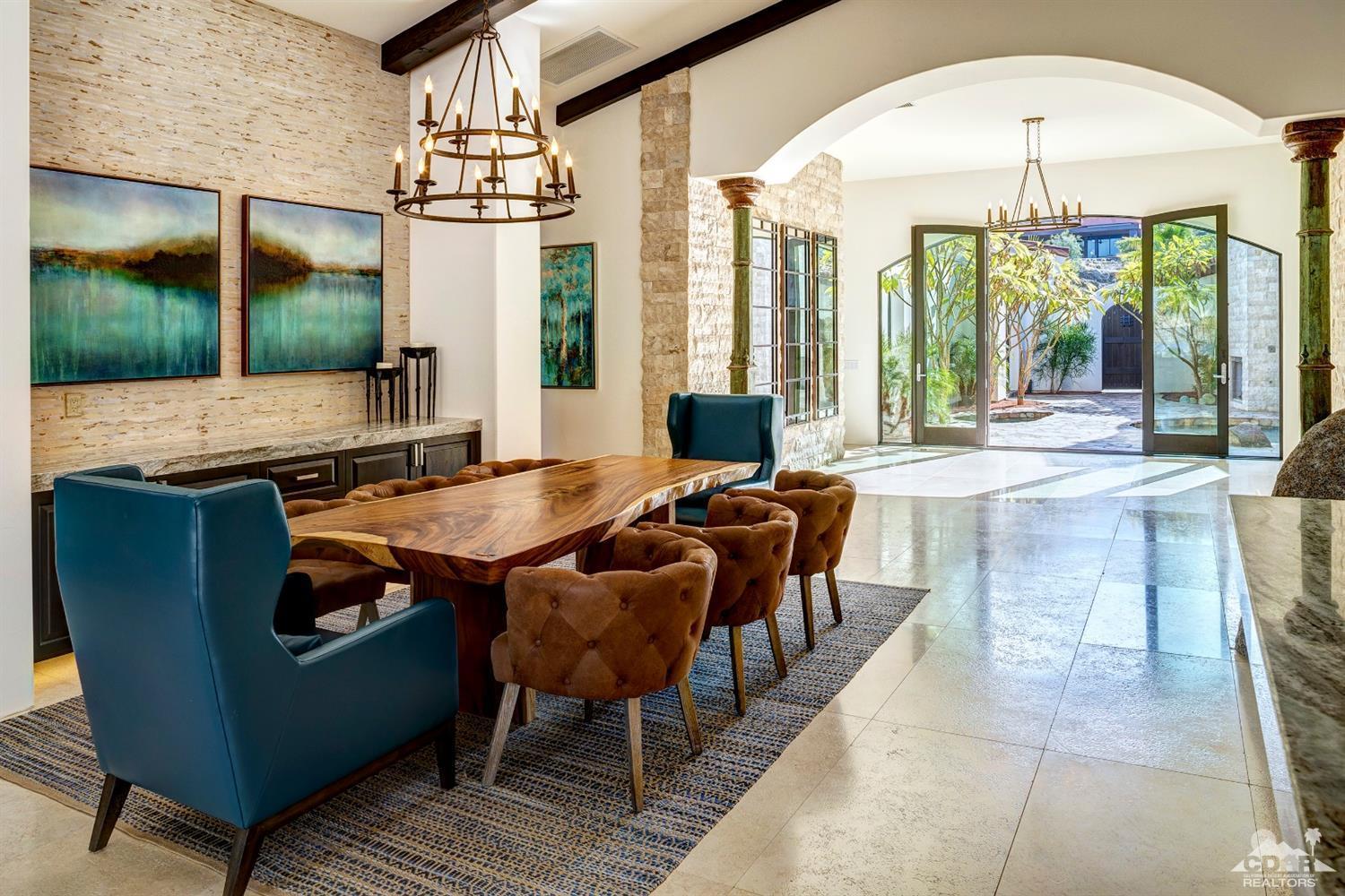 18 Rockcrest Drive Rancho Mirage, CA 92270 - Photo 10 of 35 a living room with furniture a table and chairs