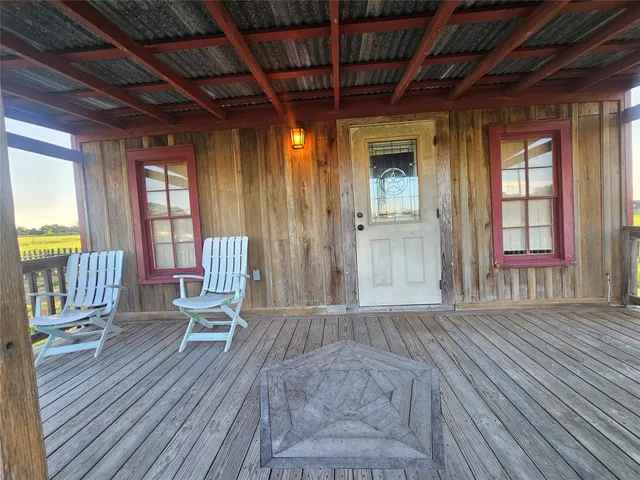 a view of a house with wooden floor and iron stairs