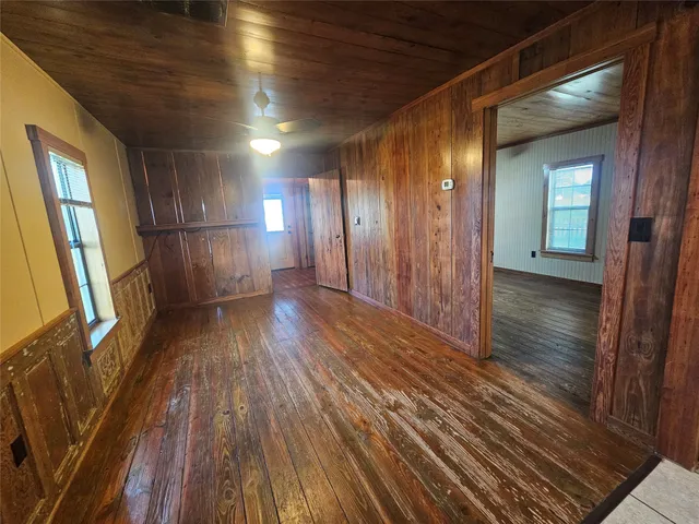 a view of hallway with wooden floor