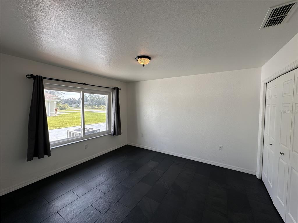 15701 Southwest 37th Circle Ocala, FL 34473 - Photo 4 of 10 an empty room with a window