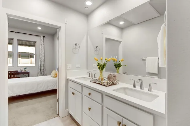 a bathroom with a glass shower door and a shower