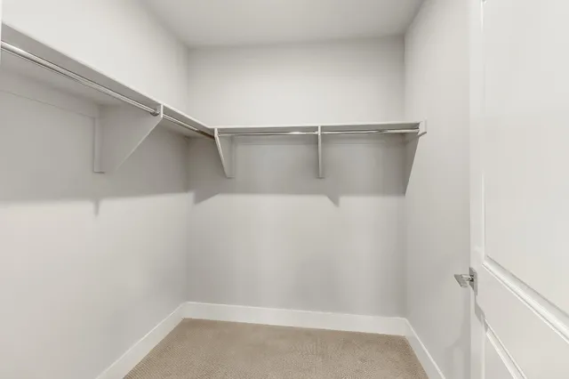 a bedroom with a bed and a table