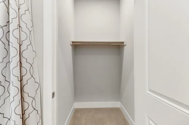 a bathroom with a shower sink and mirror