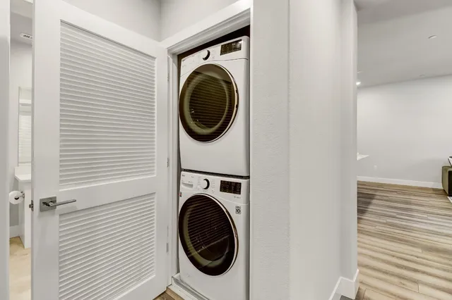 a bathroom with a sink toilet vanity and mirror