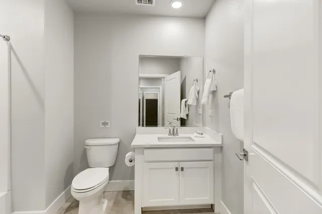 a bathroom with a shower and a toilet