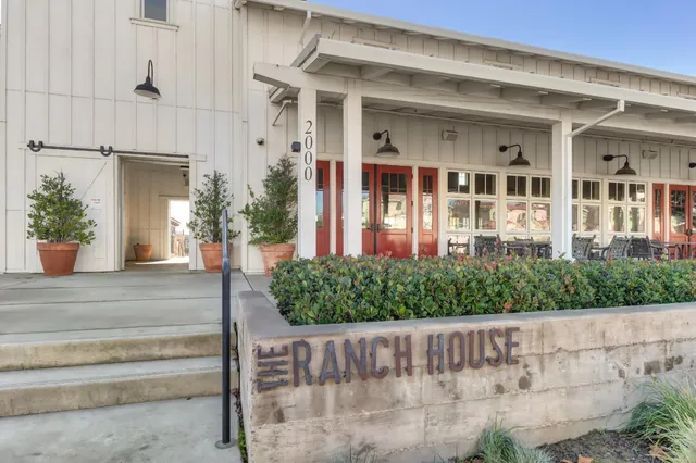 a view of yard with patio