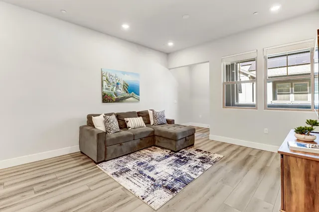a kitchen with kitchen island a sink appliances and cabinets