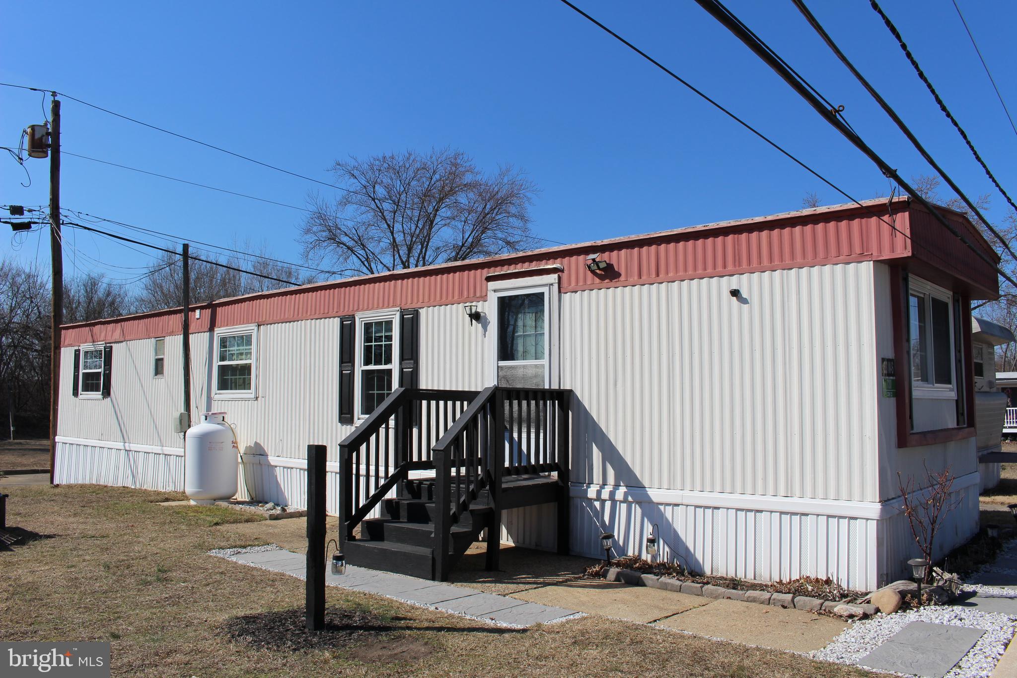 a view of a house with a wooden deck