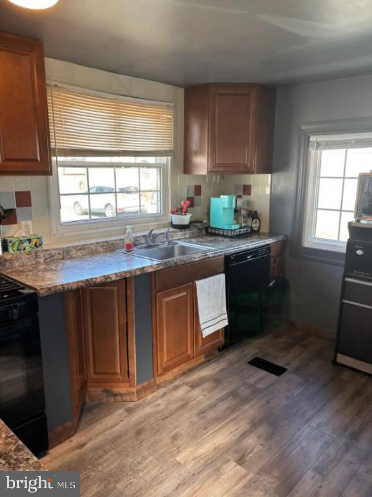 1762 Crown Point Road, Unit 33WS Thorofare, NJ 08086 - Photo 21 of 29 a kitchen with granite countertop a stove a sink dishwasher and a refrigerator