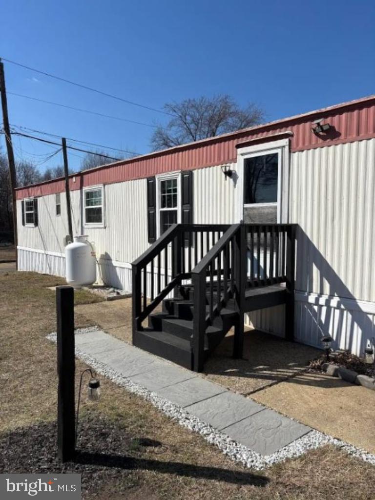 1762 Crown Point Road, Unit 33WS Thorofare, NJ 08086 - Photo 23 of 29 a view of a house with wooden floor roof and wooden fence