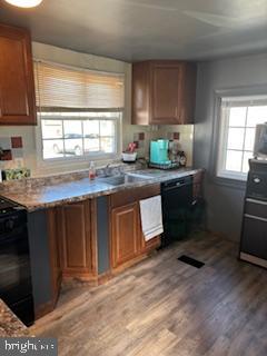 1762 Crown Point Road, Unit 33WS Thorofare, NJ 08086 - Photo 4 of 29 a kitchen with granite countertop a stove a sink dishwasher and a refrigerator