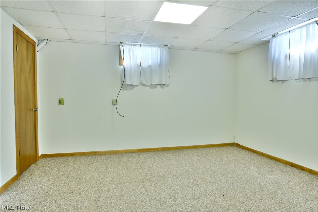 6570 Spencer Clark Road Fowler, OH 44418 - Photo 36 of 49 Basement featuring light colored carpet and a drop ceiling