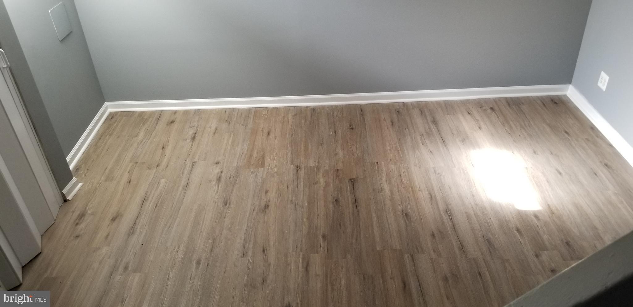 1021 Wedgewood Road Baltimore, MD 21229 - Photo 11 of 12 New floors in Lower Level Family Room