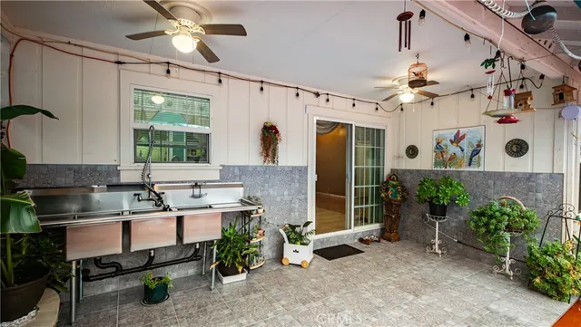 a kitchen with a refrigerator and a sink