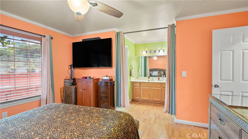 19070 Ravenhill Road Hidden Valley Lake, CA 95467 - Photo 9 of 27 a bedroom with a bed and a flat screen tv