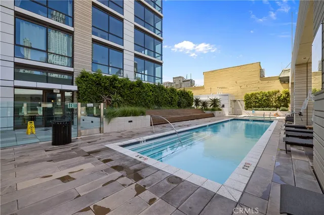 a view of a swimming pool with a lounge chairs