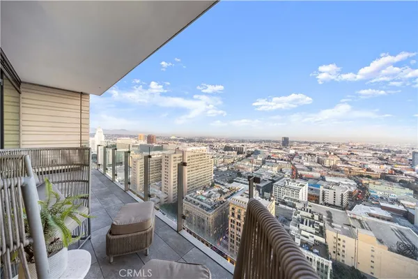 a view of roof deck with furniture