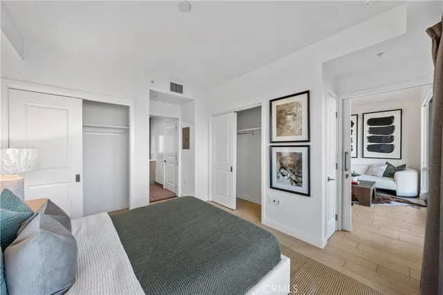 a bedroom with a bed and a couch