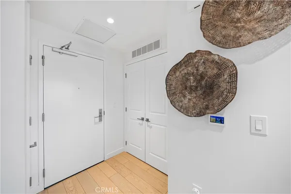 a view of a hallway with a chandelier