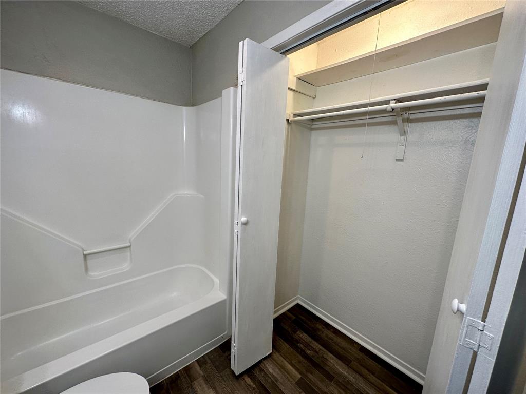 9696 Walnut Street, Unit 617 Dallas, TX 75243 - Photo 12 of 13 a bathroom with a bathtub and a shower