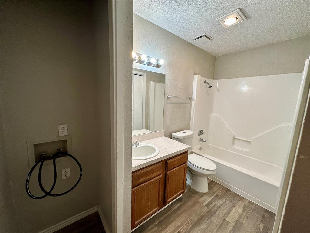 9696 Walnut Street, Unit 617 Dallas, TX 75243 - Photo 10 of 13 a bathroom with a granite countertop sink toilet and shower