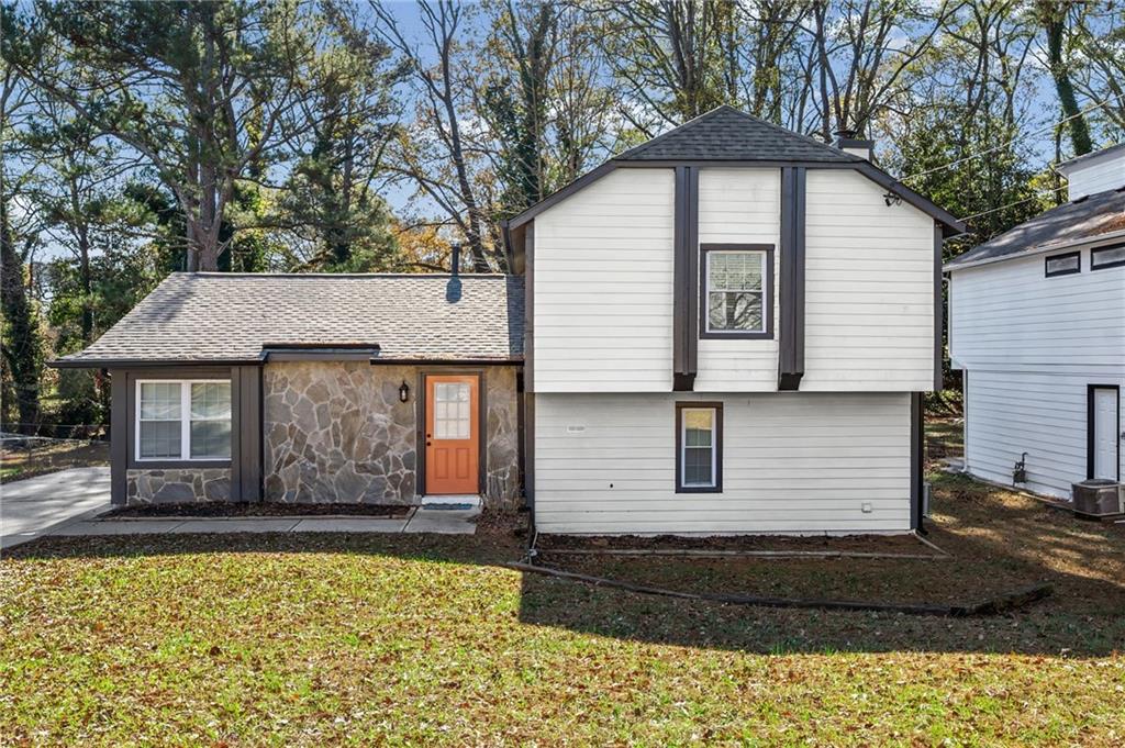 2468 Leslie Brook Drive Decatur, GA 30035 - Photo 1 of 39 a front view of a house with garage