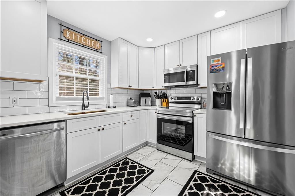2468 Leslie Brook Drive Decatur, GA 30035 - Photo 14 of 39 a kitchen with a refrigerator a sink and a stove