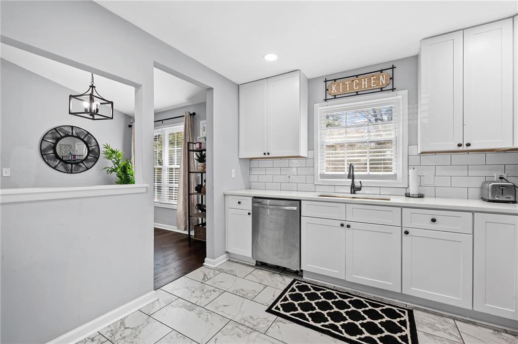 2468 Leslie Brook Drive Decatur, GA 30035 - Photo 15 of 39 a kitchen with a refrigerator a stove a sink and cabinets