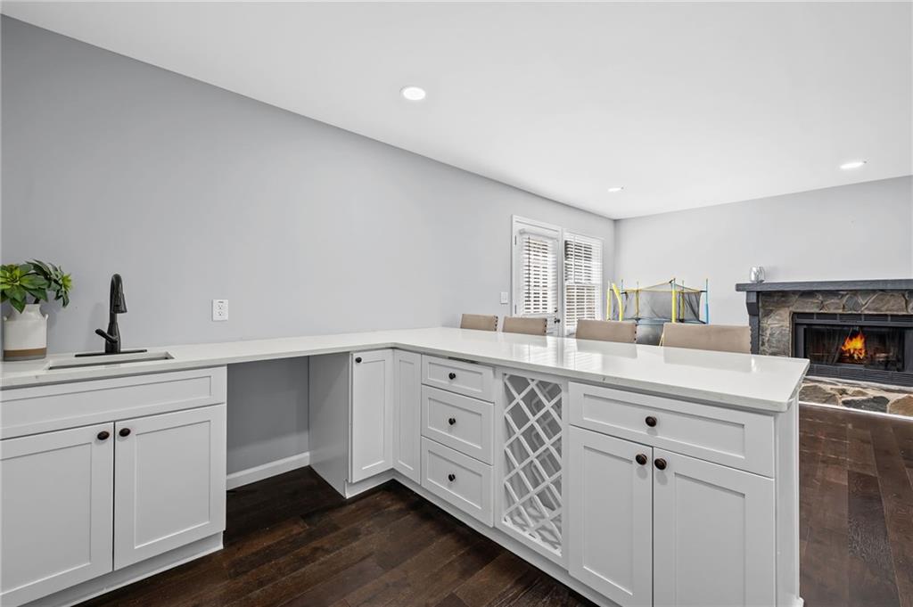 2468 Leslie Brook Drive Decatur, GA 30035 - Photo 19 of 39 a kitchen with white cabinets a sink and dishwasher