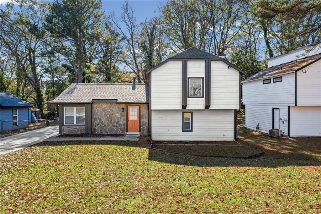 2468 Leslie Brook Drive Decatur, GA 30035 - Photo 2 of 39 a front view of a house with a yard
