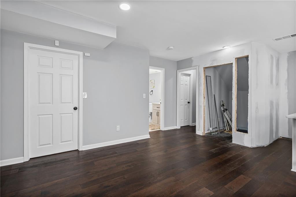 2468 Leslie Brook Drive Decatur, GA 30035 - Photo 22 of 39 a view of an empty room with wooden floor