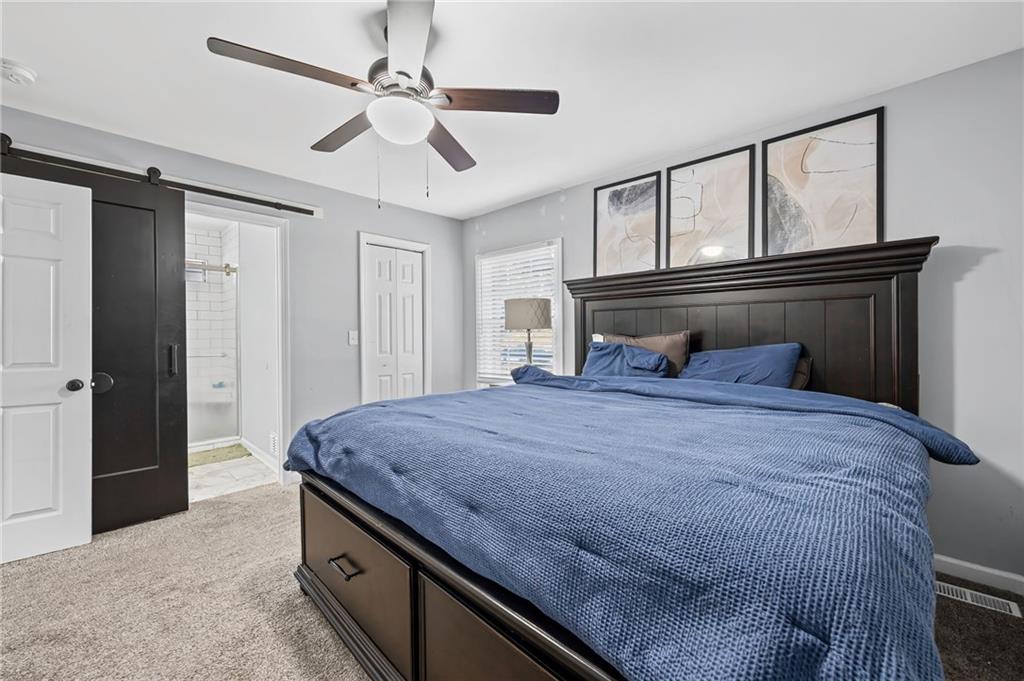 2468 Leslie Brook Drive Decatur, GA 30035 - Photo 25 of 39 a bedroom with a bed and cabinets