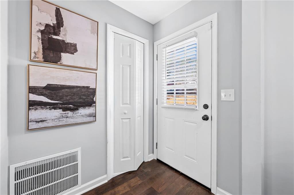 2468 Leslie Brook Drive Decatur, GA 30035 - Photo 7 of 39 a view of a hallway with wooden floor and closet
