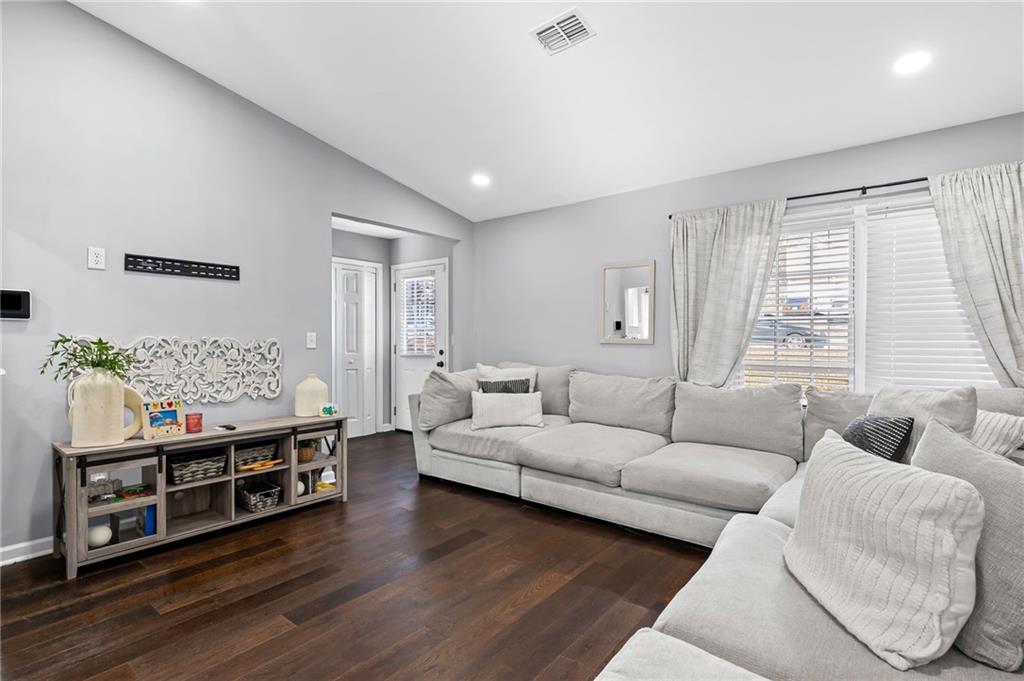2468 Leslie Brook Drive Decatur, GA 30035 - Photo 9 of 39 a living room with furniture and a flat screen tv