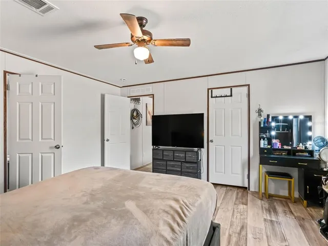 a bedroom with a bed and a dresser