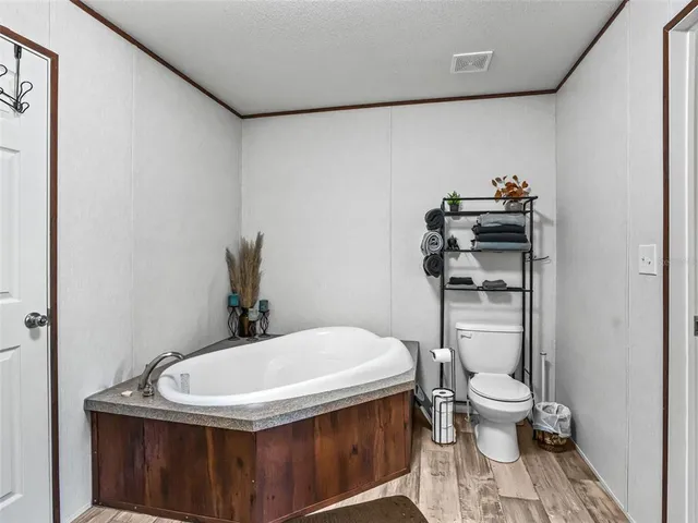 a room with a dresser and a window