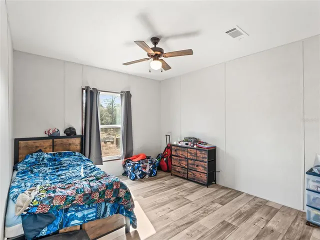 a bed room with a bed and a window